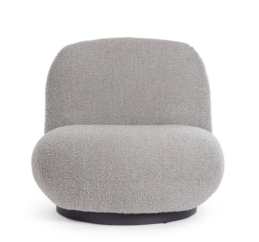 poltrona girevole margot in tessuto effetto bouclé grigio, vista ambientata in soggiorno o angolo lettura