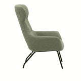 poltrona haiti in tessuto verde e gambe in metallo nero, vista ambientata in soggiorno o angolo lettura