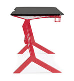scrivania gaming in legno e pvc nero con base acciaio rosso, 118 x 65 cm, ambientazione d’arredo con il prodotto protagonista