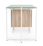 scrivania thomas in vetro temperato e base acciaio bianco, con cassettiera 142 x 69 cm, ambientazione d’arredo con il...