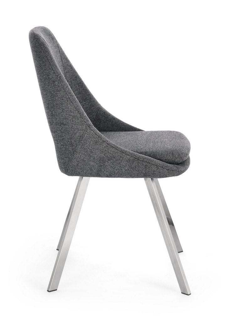 set di 2 sedie kashar in tessuto grigio scuro e gambe acciaio, vista ambientata attorno a un tavolo da pranzo