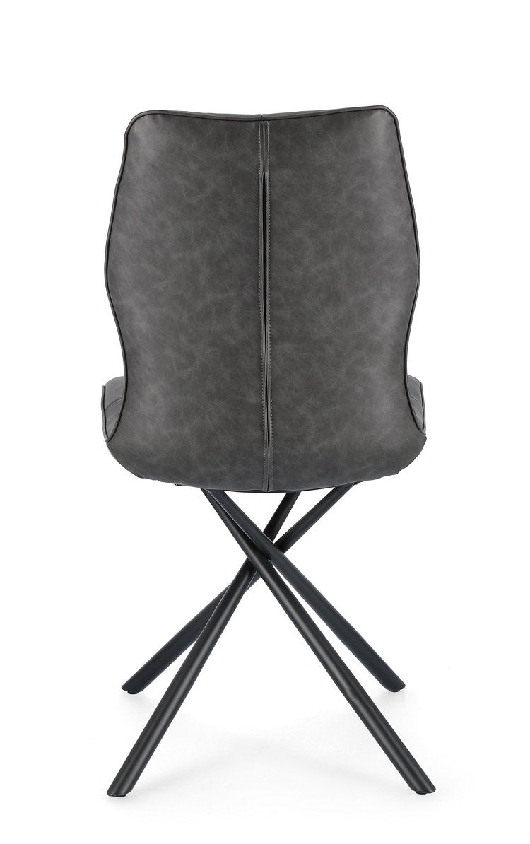 set di 2 sedie kepler in similpelle antracite e gambe incrociate nere, vista ambientata attorno a un tavolo da pranzo