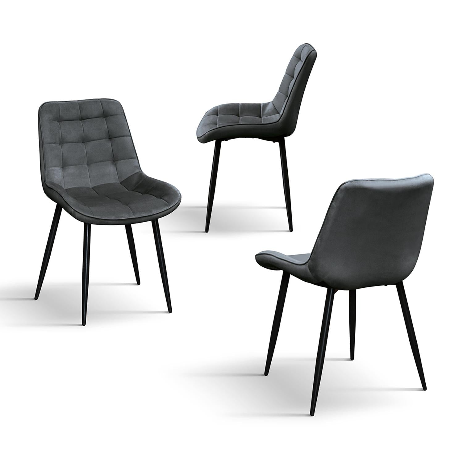 set di 4 sedie barcellona rivestite in velluto grigio e gambe in metallo nero, vista ambientata attorno a un tavolo da pranzo