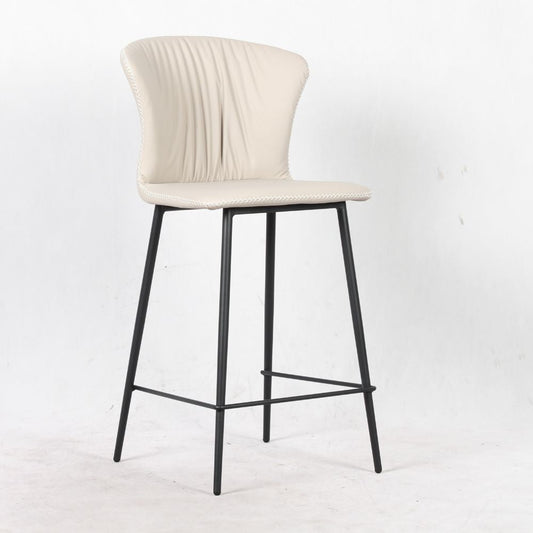 sgabello core colore beige con gambe in metallo nero, dettaglio della seduta imbottita o in legno