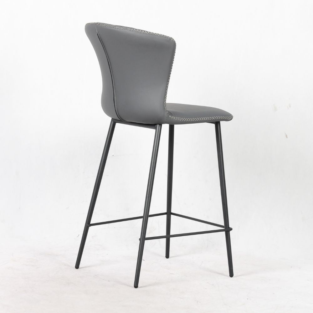 sgabello core colore antracite con gambe in metallo nero, design salvaspazio ideale per ambienti contemporanei