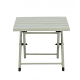 tavolino taylor in alluminio verde chiaro, pieghevole, vista ambientata su terrazza o veranda