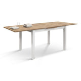 tavolo positano in legno effetto rovere e gambe bianche, allungabile 140x80 cm – 220×90 cm, vista ambientata con sedie...