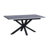 tavolo rettangolare allungabile rob con piano cemento e gambe in metallo nero, dettaglio della superficie allungata e gambe robuste