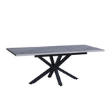 tavolo rettangolare allungabile rob con piano cemento e gambe in metallo nero, ideale per ospitare numerosi commensali