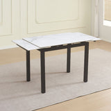 tavolo allungabile kyoto con piano in ceramica effetto marmo bianco lucido e struttura in metallo nero, vista ambientata in spazi open space moderni