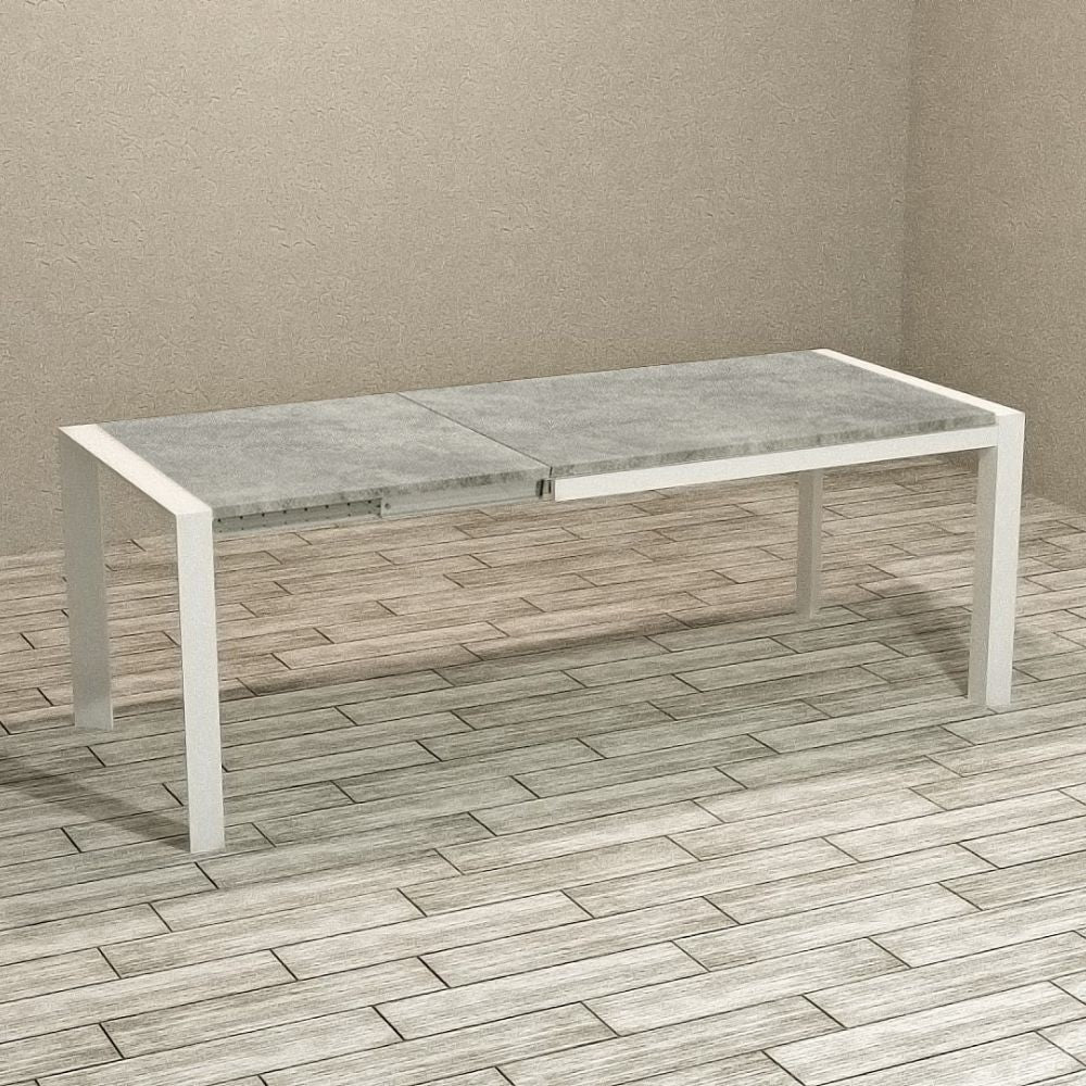 tavolo rettangolare allungabile golia 130x80 struttura bianco e piano cemento, dettaglio della superficie allungata e gambe robuste