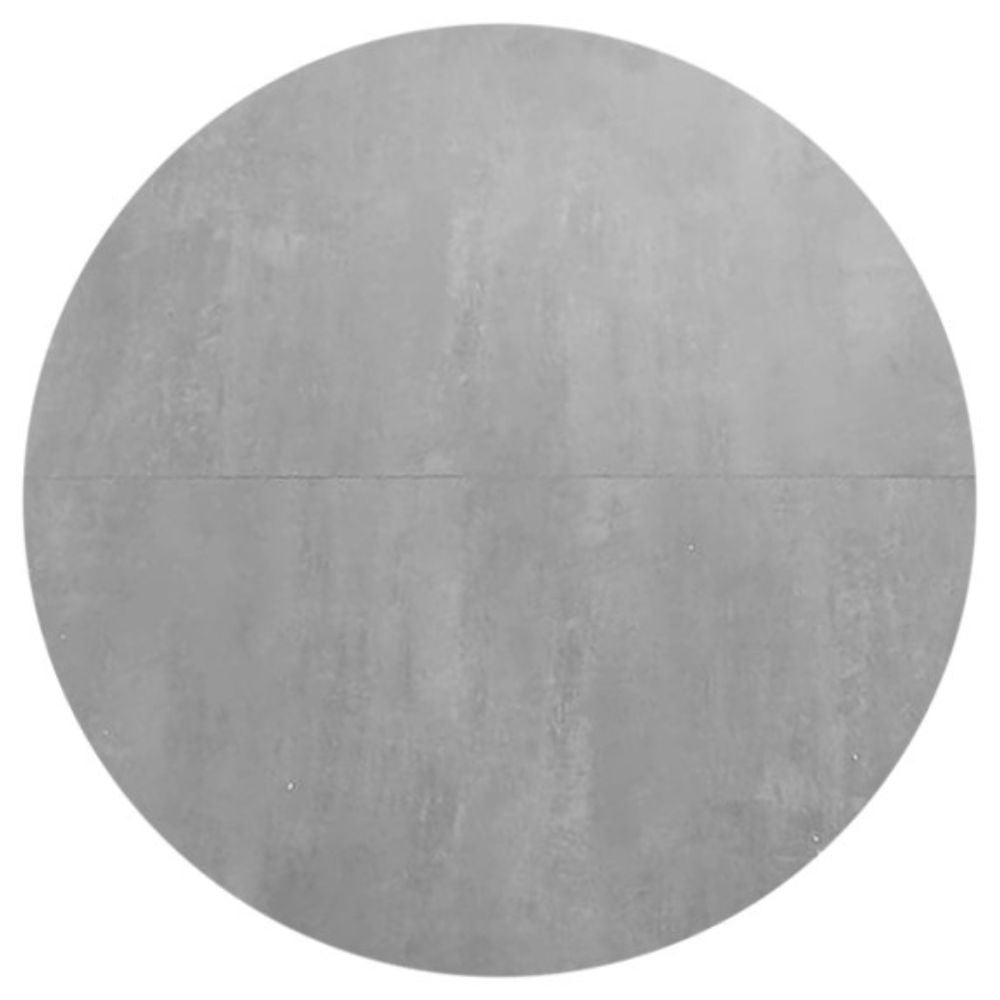 tavolo rotondo allungabile rut con piano colore cemento e gambe in metallo nero, forma accogliente che favorisce la socialità