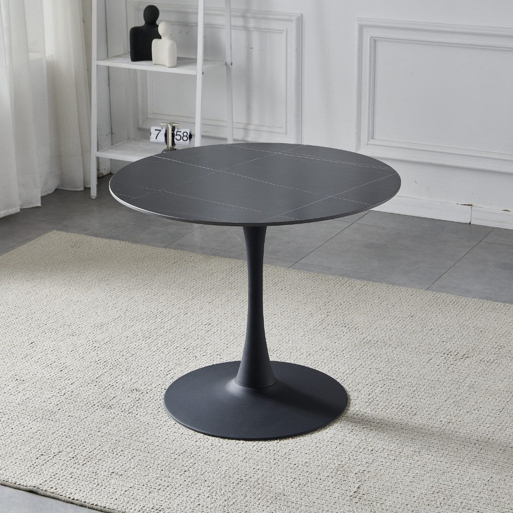 tavolo rotondo dot con piano in ceramica effetto marmo nero opaco con particolari oro e gamba nera, dettaglio del piano circolare e supporto centrale