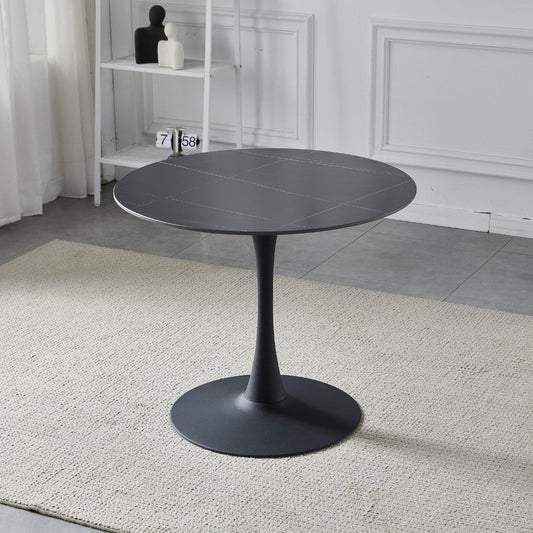 tavolo rotondo dot con piano in ceramica effetto marmo nero opaco con particolari oro e gamba nera, dettaglio del piano circolare e supporto centrale