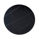 tavolo rotondo dot con piano in ceramica effetto marmo nero opaco con particolari oro e gamba nera, design compatto ma funzionale