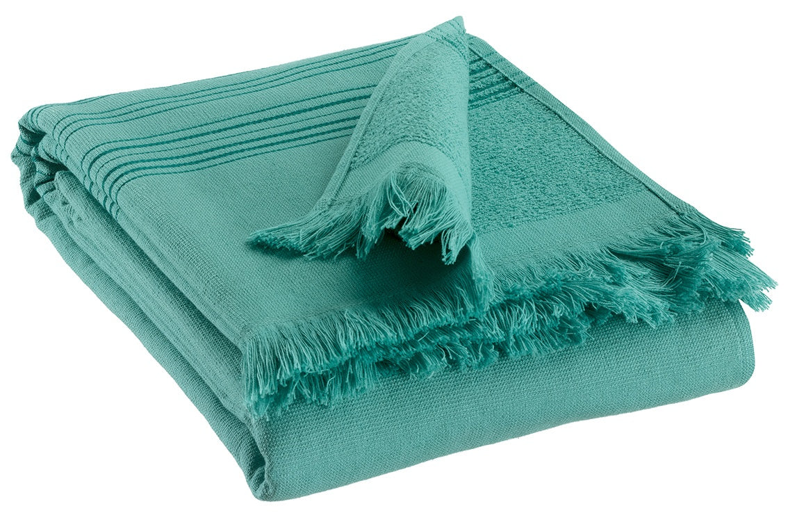 telo hammam cancun curacao, colore curacao, taglia 90 x 180. telo hammam elegante piegato con cura su sfondo neutro