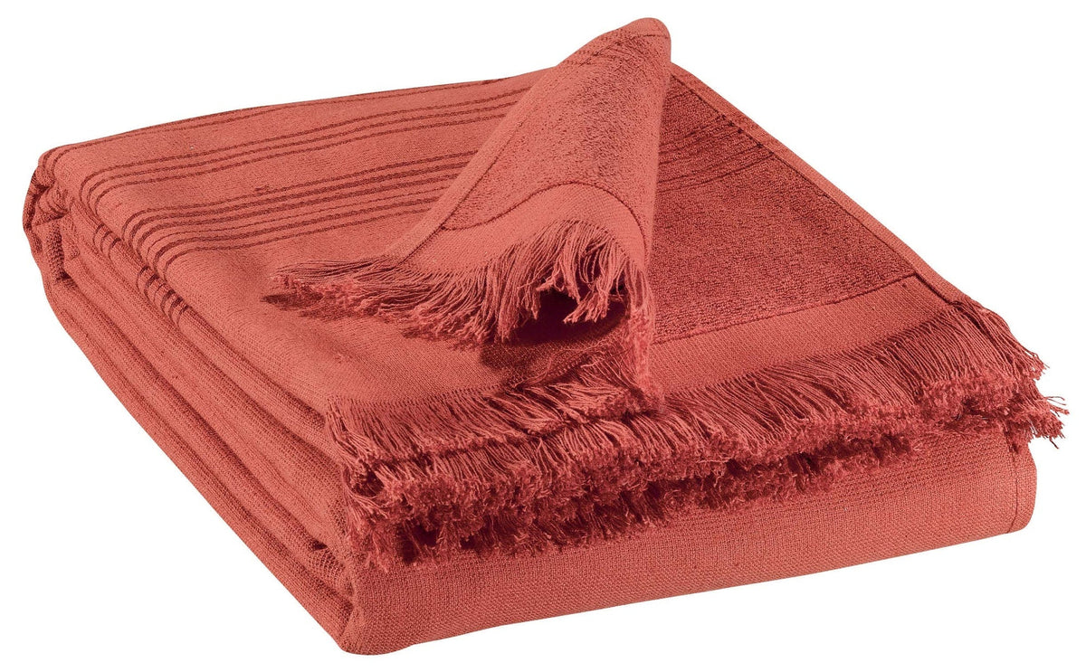 telo hammam cancun tomette, colore tomette, taglia 90 x 180. telo hammam elegante piegato con cura su sfondo neutro