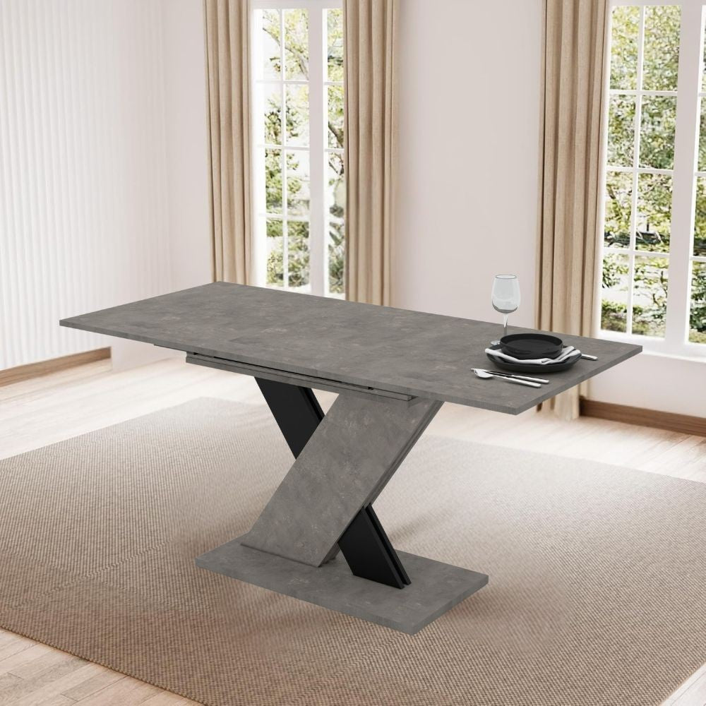 Tavolo allungabile Axi in cemento con dettaglio nero